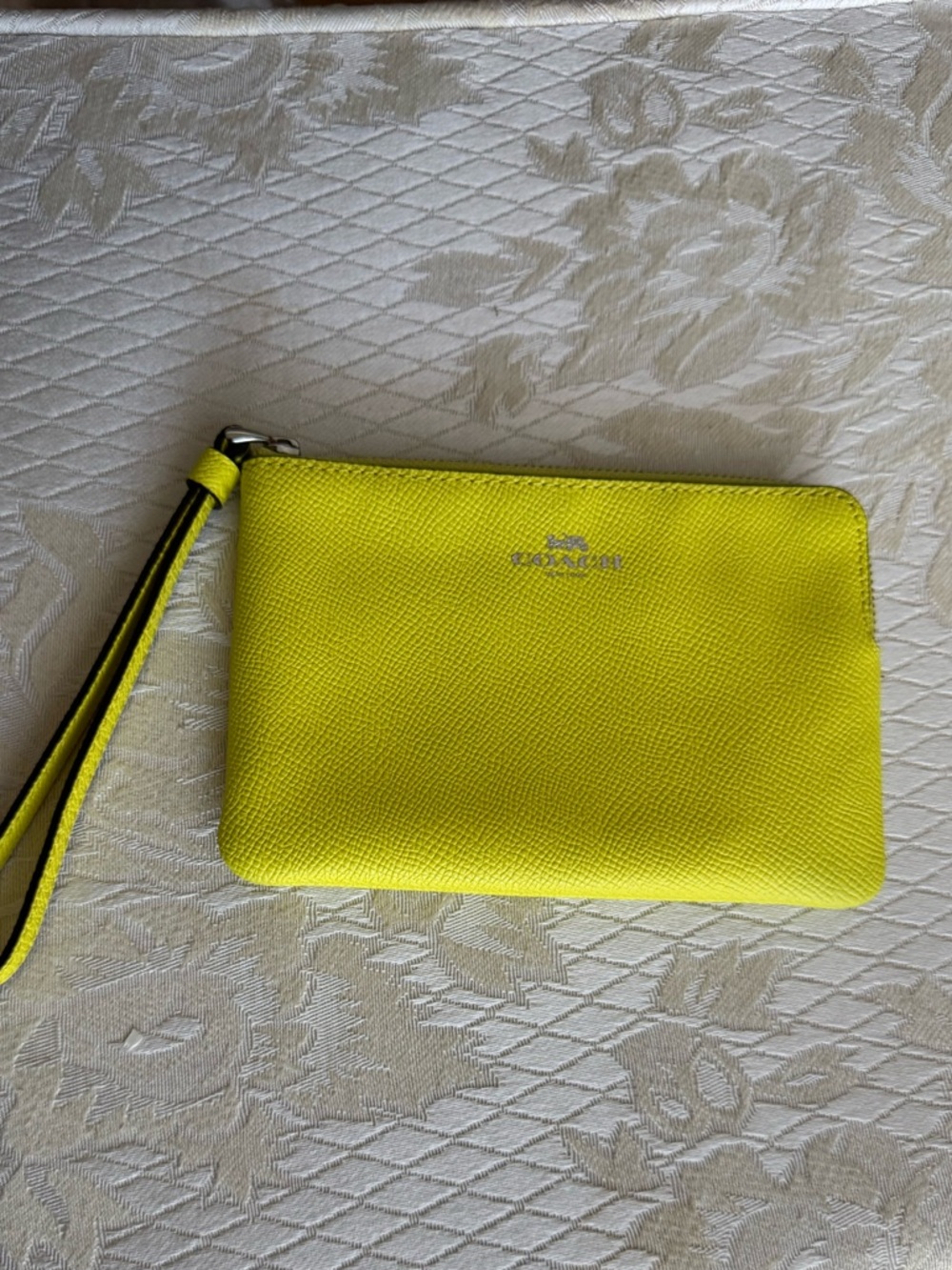 Coach corner zip wristlet in bright yellow leather